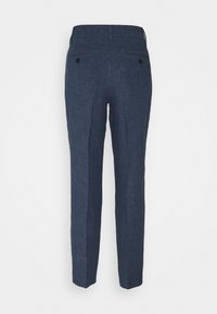 Pantalons bleu marine en tissu texturé, à coupe slim, avec deux poches arrière à boutons et une taille épurée.