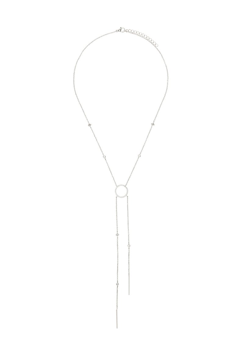 Srebrny naszyjnik z okrągłym wisiorkiem na środku. Dwie wydłużone łańcuszki opadają w dół, zdobione małymi gwiazdkami. Minimalistyczny design.