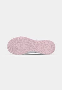 Sneaker outsole in white and pink, featuring a textured surface with circular patterns and a logo detail, designed for traction and support.