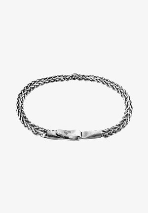 Silver bracelet featuring a woven chain design with a smooth, polished clasp. The texture is consistent throughout, with a shiny finish.