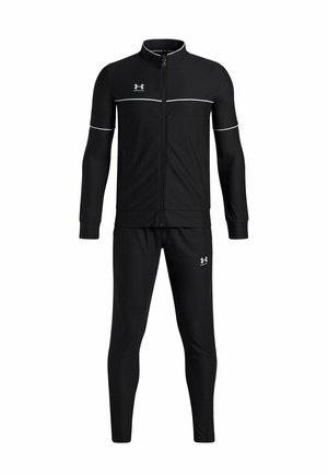 Black Under Armour tracksuit with full-zip jacket, white piping details on sleeves and chest, and matching tapered pants with logo on thigh.