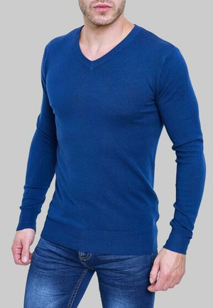 Pull en V pour homme en bleu marine uni, en tissu tricoté, au design ajusté avec des manches longues, des poignets côtes et un ourlet côtelé.