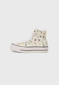 Högkänning sneakers i vit kanvas med färgglad blommönster, svart gummisula och en kontrasterande svart rand runt basen.