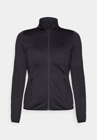 Chaqueta deportiva negra con cremallera, cuello alto, mangas largas, paneles estructurados y dos bolsillos frontales con cremallera. Tejido suave y elástico con una textura lisa.