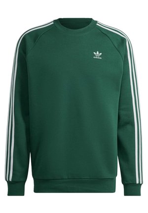 Ciemnozielona bluza Adidas z białymi trzema paskami na rękawach i małym białym logo Adidas na lewej piersi.