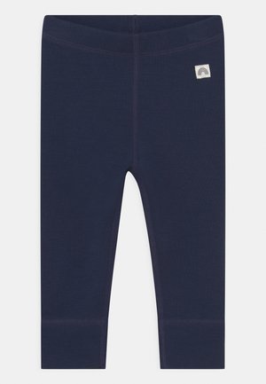 Marineblaue Leggings aus dehnbarem Material, mit strukturiertem Nähten, eng anliegendem Schnitt und einem kleinen dekorativen Patch mit Regenbogenmotiv.