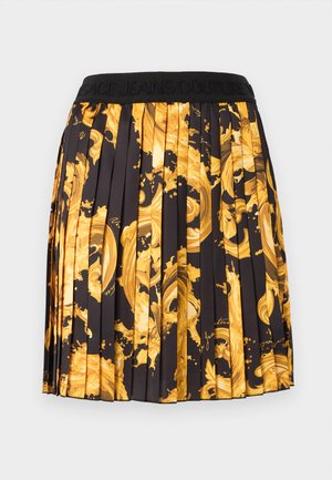 Čierna plisovaná sukňa s odvážnymi žltými barokovými špirálovými vzormi a čiernym pásom s vyrazeným názvom značky.