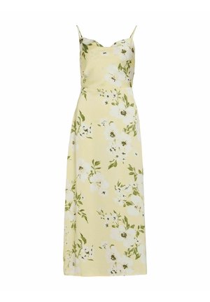 Robe midi jaune à fleurs avec fines bretelles et motifs de fleurs blanches soulignés par des feuilles vertes.