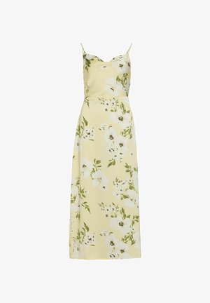 Robe midi jaune à fleurs avec fines bretelles et motifs de fleurs blanches soulignés par des feuilles vertes.