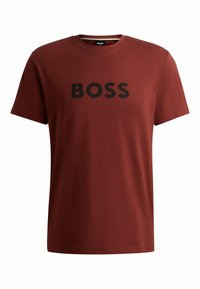 T-shirt in cotone color bordeaux con logo "BOSS" nero sul fronte. Design a collo rotondo con maniche corte e vestibilità regolare.