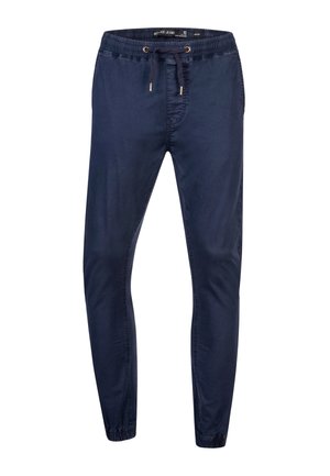 Pantalon de jogging slim bleu marine avec taille élastique, cordon, poches latérales et poignets élastiques, fabriqué en tissu léger.