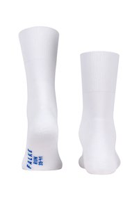 Balti laivai kojinės, pagamintos iš glotnaus audinio. Su raštuotais kraštais ir mėlynu "FALKE" logotipu ties kulkšnimi. Paprastas ir minimalistinis dizainas.
