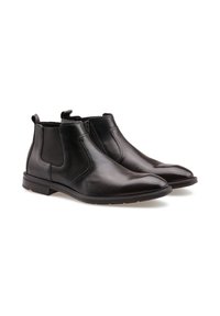 Bottines en cuir noir avec des panneaux élastiques sur les côtés, bout arrondi élégant et semelle texturée pour une meilleure adhérence. Design simple pour un usage polyvalent.