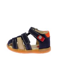 Navy and beige children's sandal with adjustable straps, rubber sole, and orange accent. Textured upper with stitching details.