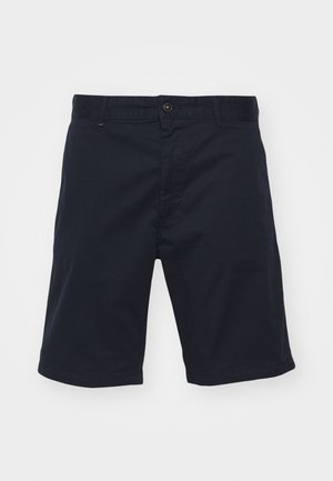 Pantalones cortos de algodón azul marino con cierre de botón, corte recto y bolsillos frontales. Presentan una textura suave y un diseño sencillo.