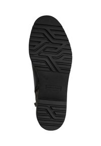 Semelle extérieure en caoutchouc noir avec un motif de tread texturé ; présente la marque "MARCO TOZZI" et la taille "37". Fini lisse avec un design durable.