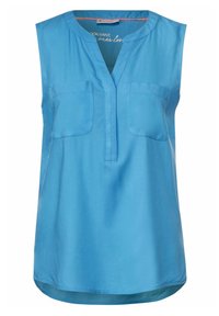 Blå ärmlös topp med V-ringning, två bröstfickor och en slät, blank yta. Rundad nederkant.