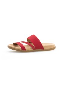 Red slide sandal with two wide soft fabric straps and a flat tan textured sole, featuring a smooth finish for comfort during wear.
