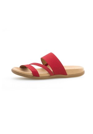 Red slide sandal with two wide soft fabric straps and a flat tan textured sole, featuring a smooth finish for comfort during wear.