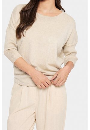 Stickad tröja - beige