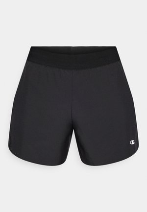 Pantalones cortos deportivos negros con textura suave, cintura elástica y logo en la esquina inferior izquierda delantera. Diseño ligero.