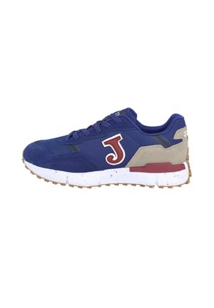 Zapatilla azul y beige con logo "J" granate, suela blanca con salpicaduras y suela exterior de goma, vista de lado sobre fondo blanco.