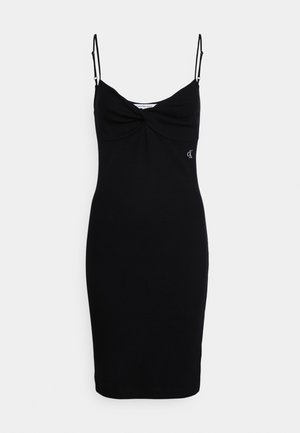 Vestido negro ajustado hasta la rodilla con tirantes finos ajustables, busto ligeramente fruncido y pequeño logo blanco de CK en el lado derecho.