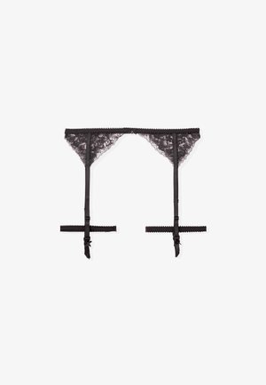 Cinturilla de encaje negro con correas ajustables, bordes en forma de concha y acentos de lazo. Presenta un delicado patrón floral en toda su superficie.