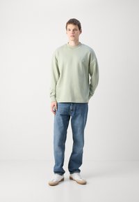 HUGO NINNYO - Felpa - light pastel green