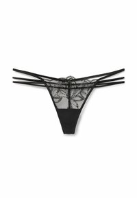 Lingerie noire avec un dos en dentelle à motifs floraux, un devant lisse et plusieurs fines lanières sur les côtés.