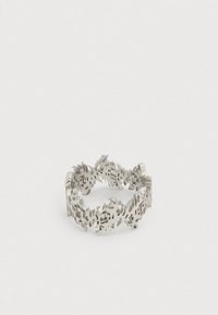 Silver metal ring with repeating cut-out tiger head designs encircling the band on a plain white background.