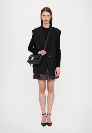 ADDI POUCHETTE - Cross body bag - black