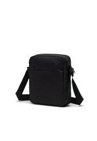 Borsa a tracolla rettangolare nera in tessuto, dotata di chiusura con zip, tracolla regolabile e tasca anteriore per ulteriore spazio di stoccaggio.