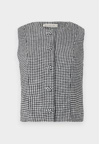 Svart och vit rutmönstrad ärmlös topp med rund halsringning och fyra dekorativa knappar fram. Tillverkad av lättviktsmaterial.