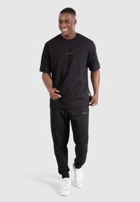 Smilodox OSKAR - Jednoduché tričko - schwarz