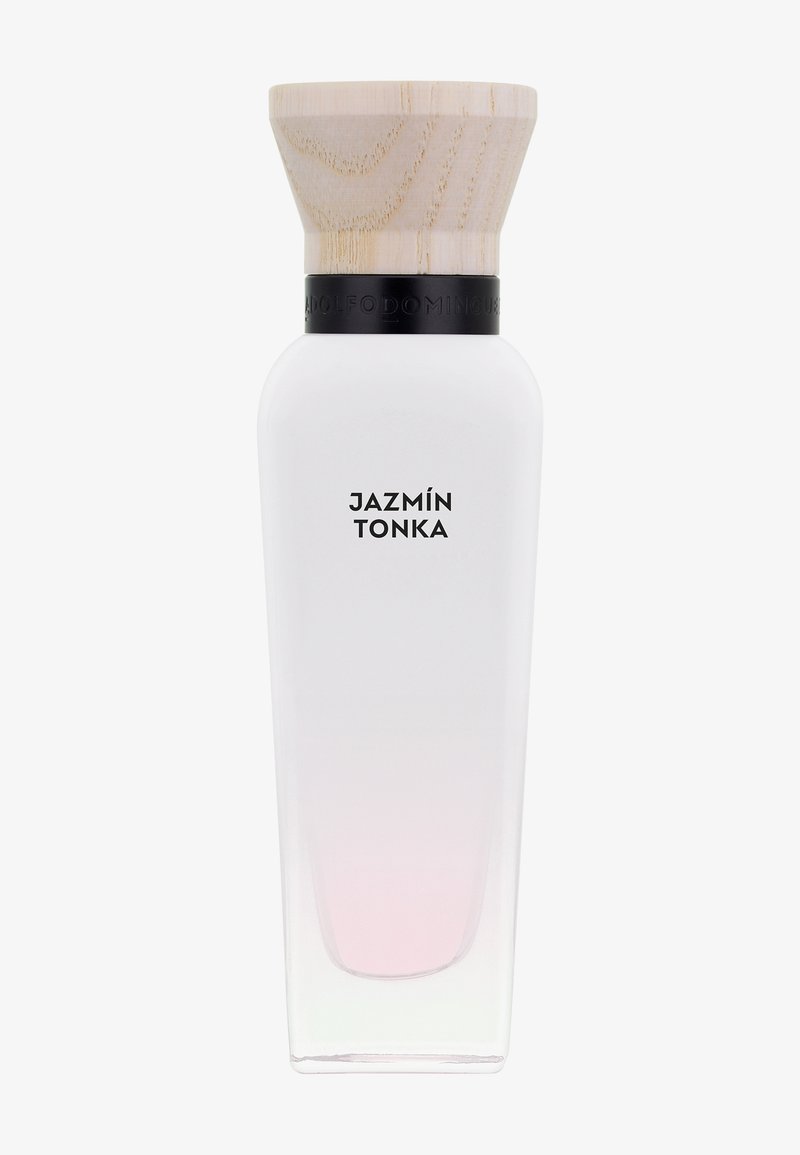 Grande bouteille de parfum en verre givré avec liquide rose clair, col noir, bouchon en bois, étiquetée « Jazmín Tonka ».