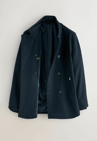 Marineblauer doppelt geknöpfter Mantel aus strukturiertem Stoff, mit zwei Vordertaschen, Knopfverschluss und einem glatten Innenfutter.