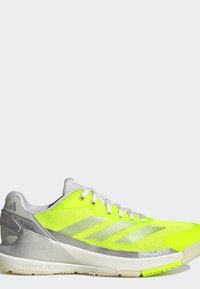 Neon yellow and silver athletic running shoe with white laces, mesh upper, and cushioned sole, shown in side profile on a plain background.