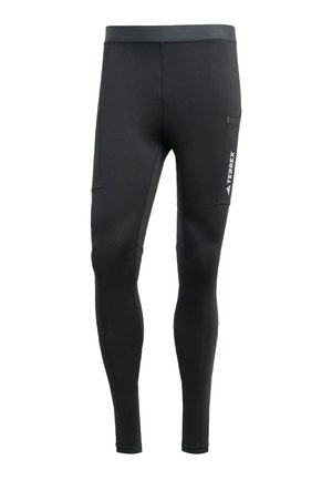 Zwarte sportleggins gemaakt van een gladde, rekbare stof. Kenmerken zijn een zijzak en een logo op de dij.