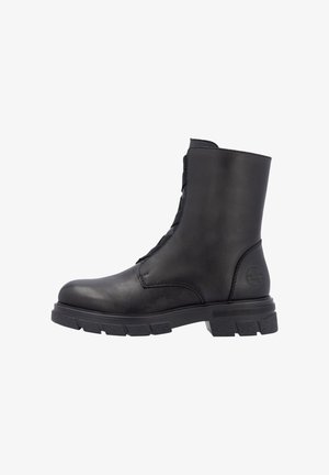 Botte chelsea en cuir noir avec une finition texturée, lacets sur le devant et une semelle en caoutchouc robuste présentant des crampons profonds pour une adhérence optimale.