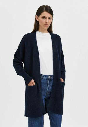 Cardigan de culoare bleumarin, confecționat dintr-un material moale, cu un design deschis în față, mâneci lungi și două buzunare frontale; croială relaxată, supradimensionată.