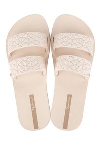 Infradito beige chiaro con cinturini in tessuto intrecciato e motivo in rilievo sulla suola. Presentano una suola in gomma e dettagli del logo sulla soletta.