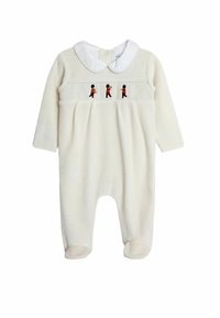 Krémová detská kombinéza s dlhými rukávmi, bielym golierom a vyšitými postavičkami v červených uniformách. Mäkká textura, uzavreté nohy.