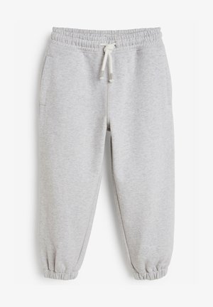 Pantaloni grigi in pile morbido, dotati di una vita elasticizzata con cordino, polsini elasticizzati e tasche laterali.