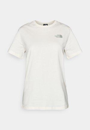 Crème katoenen t-shirt met korte mouwen, ronde halslijn en een klein groen logo op de linkerborst. Glad texture, casual fit.