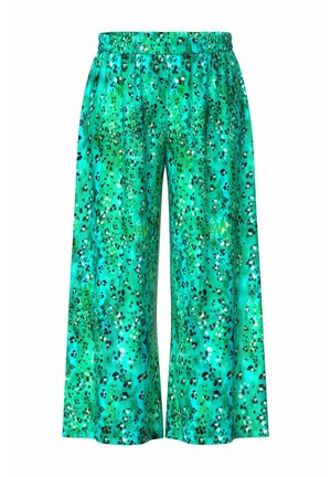 Løse, vidde bukser i turkis med elastisk linning, prydet med et grønt og sort plettet leopardmønster.