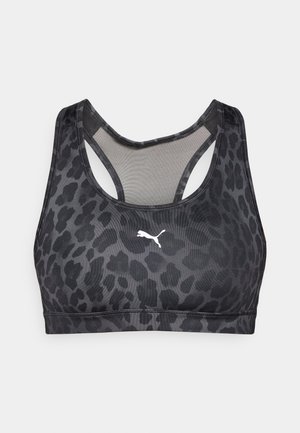 Brassière de sport noire avec un imprimé léopard, en tissu extensible. Dotée d'un dos nageur et d'un logo Puma blanc sur le devant.