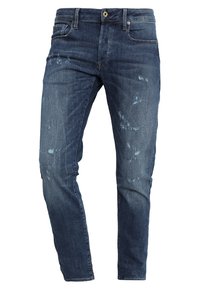 Blå denimjeans med slim fit, med slitningar fram, fem fickor och en knappstängning i midjan.