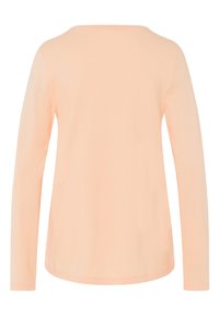 Perzikkleurig shirt met lange mouwen van zachte katoen. Het heeft een ronde hals en een gladde, eenvoudige achterkant met aansluitende mouwen.
