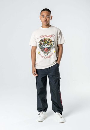 DESTINY SKULL WINGS - Cargo trousers - washed black